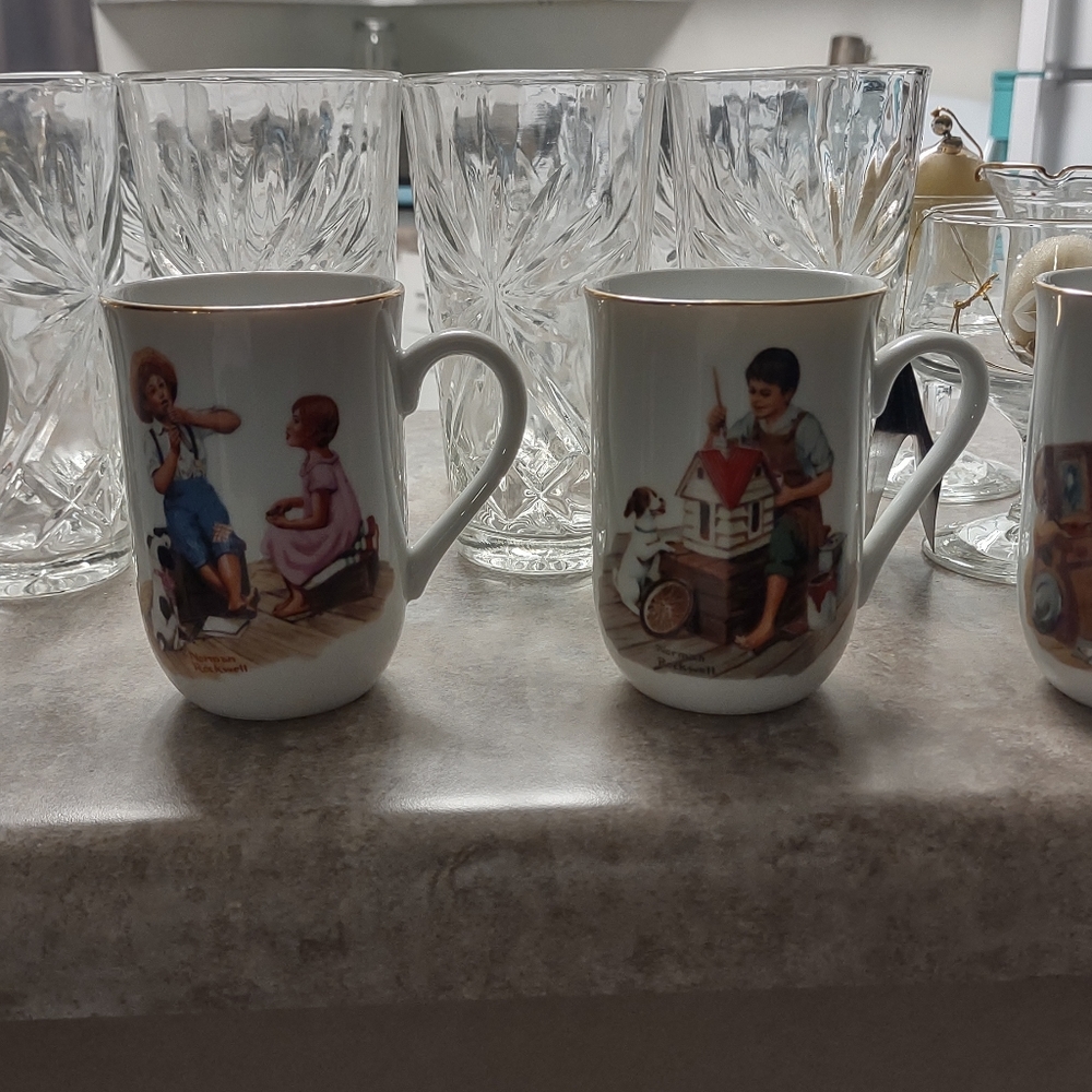 Set of four pristine conditions Norman Rockwell 24 K trimmed coffee mug set